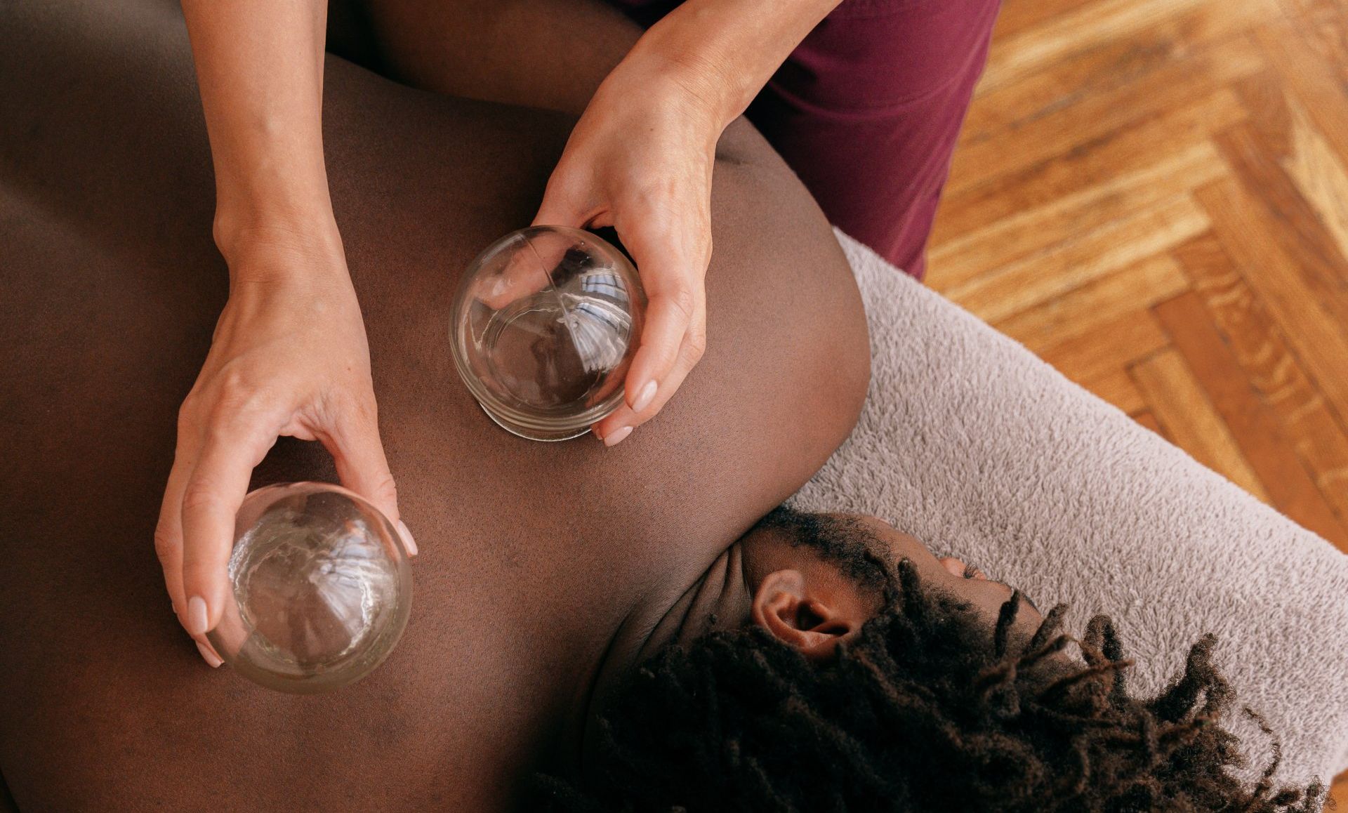 A logo for helping hands with a heart surrounded by hands